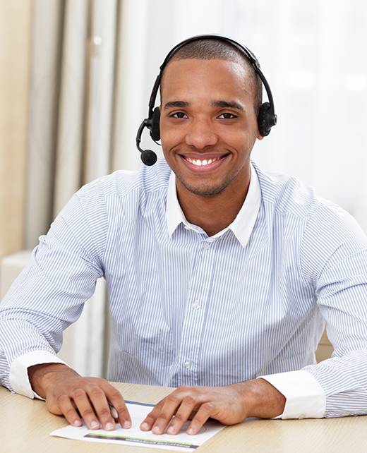 young african american call center consultant with headset in office